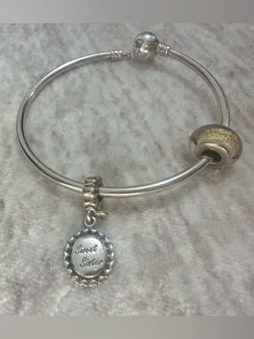 Pandora Sterling Silver Bangle with gold and Pink murano Glass and sister Charms